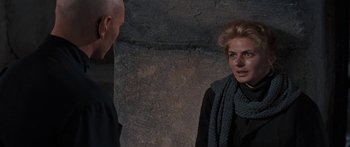 Movie still from “Anastasia” (1956), directed by Anatole Litvak – A woman wearing a scarf and a black jacket; Close Up shot, Over the shoulder angle