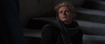 Movie still from “Anastasia” (1956), directed by Anatole Litvak – A woman in a black shirt and a scarf looking up; Close Up shot, Low angle