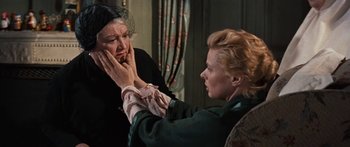 Movie still from “Anastasia” (1956), directed by Anatole Litvak – Two women are looking at each other in front of a mirror; Close Up shot, Over the shoulder angle