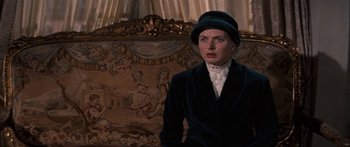 Movie still from “Anastasia” (1956), directed by Anatole Litvak – A woman wearing a black hat and a black jacket; Medium shot, Over the shoulder angle