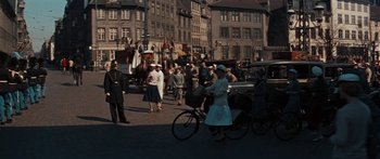 Movie still from “Anastasia” (1956), directed by Anatole Litvak – A group of people walking down a street; Extreme Wide shot, High angle