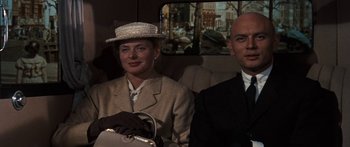 Movie still from “Anastasia” (1956), directed by Anatole Litvak – A man and a woman sitting in a car; Medium shot, Low angle