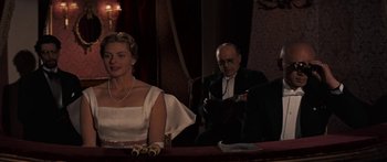 Movie still from “Anastasia” (1956), directed by Anatole Litvak – A man and a woman sitting at a table; Medium shot, Over the shoulder angle