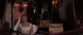 Movie still from “Anastasia” (1956), directed by Anatole Litvak – A group of people standing in a room; Medium shot, Over the shoulder angle