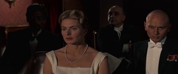 Movie still from “Anastasia” (1956), directed by Anatole Litvak – A man and a woman sitting in front of each other; Close Up shot, Over the shoulder angle