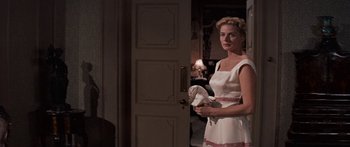 Movie still from “Anastasia” (1956), directed by Anatole Litvak – A woman standing in front of an open door; Medium shot, Over the shoulder angle