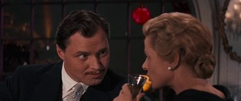 Movie still from “Anastasia” (1956), directed by Anatole Litvak – A man and a woman are drinking champagne; Close Up shot, Low angle