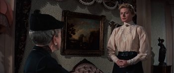 Movie still from “Anastasia” (1956), directed by Anatole Litvak – Two women in a room with a painting on the wall behind them; Medium shot, Over the shoulder angle
