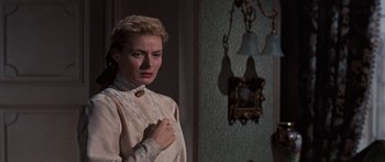 Movie still from “Anastasia” (1956), directed by Anatole Litvak – A woman standing in front of a mirror in a room; Close Up shot, Over the shoulder angle