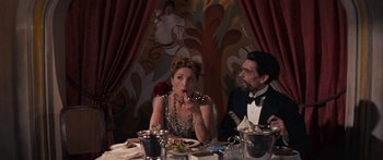 Movie still from “Anastasia” (1956), directed by Anatole Litvak – A man and a woman sitting at a dinner table; Medium shot, Over the shoulder angle