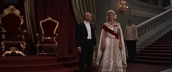 Movie still from “Anastasia” (1956), directed by Anatole Litvak – A man and a woman dressed in formal wear; Wide shot, Low angle