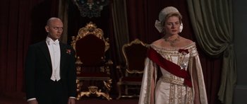 Movie still from “Anastasia” (1956), directed by Anatole Litvak – A woman in a white dress and a crown; Medium shot, Low angle