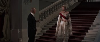 Movie still from “Anastasia” (1956), directed by Anatole Litvak – A man and a woman standing on some stairs; Wide shot, Low angle