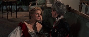 Movie still from “Anastasia” (1956), directed by Anatole Litvak – Two women in formal wear one of them is wearing a necklace; Close Up shot, Over the shoulder angle
