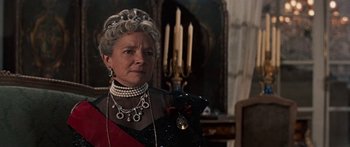 Movie still from “Anastasia” (1956), directed by Anatole Litvak – An older woman wearing a tiara and a necklace; Close Up shot, Low angle