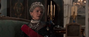 Movie still from “Anastasia” (1956), directed by Anatole Litvak – An older woman wearing a black dress and a tiara; Close Up shot, Low angle