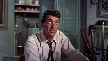 Movie still from “Artists and Models” (1955), directed by Frank Tashlin – A person wearing a shirt and a tie; Close Up shot, Low angle