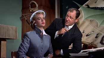Movie still from “Artists and Models” (1955), directed by Frank Tashlin – A man and a woman in a suit and tie; Medium shot, Low angle