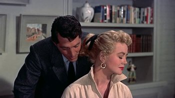 Movie still from “Artists and Models” (1955), directed by Frank Tashlin – A man and a woman are looking at each other; Close Up shot, Over the shoulder angle
