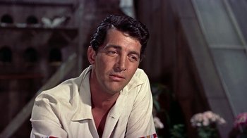 Movie still from “Artists and Models” (1955), directed by Frank Tashlin – A person wearing a white shirt; Close Up shot, Low angle