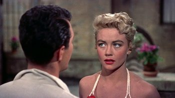 Movie still from “Artists and Models” (1955), directed by Frank Tashlin – A man and a woman looking into each other's eyes; Close Up shot, Over the shoulder angle