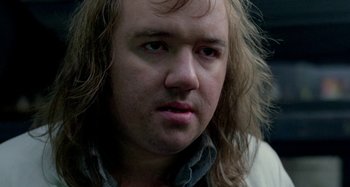 Movie still from “Babylon” (1980), directed by Franco Rosso – A person with long blonde hair; Close Up shot, Low angle