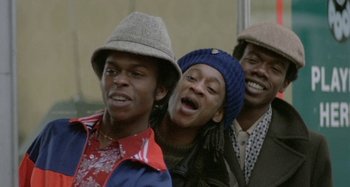 Movie still from “Babylon” (1980), directed by Franco Rosso – A group of young men standing next to each other; Close Up shot, Low angle