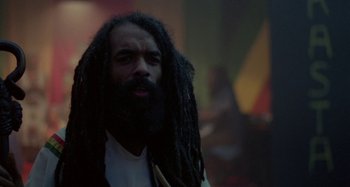 Movie still from “Babylon” (1980), directed by Franco Rosso – A person with dreadlocks; Close Up shot, Low angle