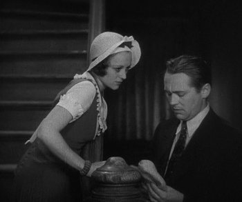 Movie still from “Bad Girl” (1931), directed by Frank Borzage – An old photo of a man and a woman; Medium shot, Low angle