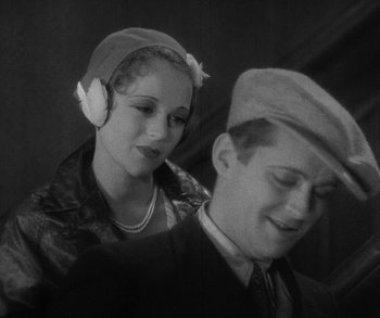 Movie still from “Bad Girl” (1931), directed by Frank Borzage – An old photo of a man and a woman; Close Up shot, High angle