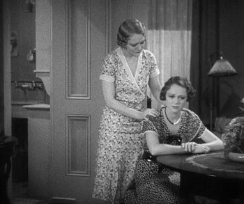 Movie still from “Bad Girl” (1931), directed by Frank Borzage – Two women are sitting at a dining room table; Medium shot, High angle