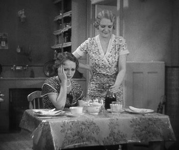 Movie still from “Bad Girl” (1931), directed by Frank Borzage – Two women sitting at a dining room table; Medium shot, High angle