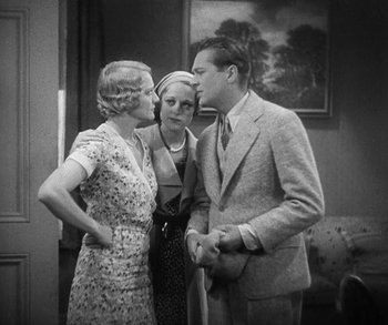 Movie still from “Bad Girl” (1931), directed by Frank Borzage – Two women and a man standing next to each other in a room; Medium shot, High angle