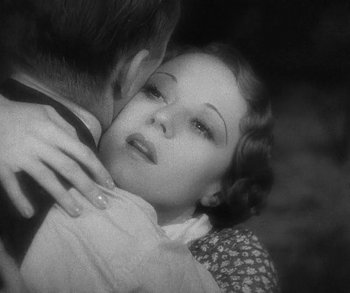 Movie still from “Bad Girl” (1931), directed by Frank Borzage – An old photo of a man and a woman hugging; Close Up shot, High angle
