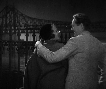 Movie still from “Bad Girl” (1931), directed by Frank Borzage – A man and a woman embracing each other; Medium shot, High angle