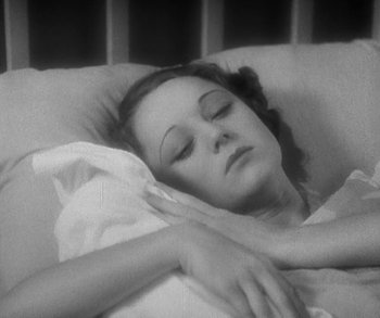Movie still from “Bad Girl” (1931), directed by Frank Borzage – A black and white photo of a woman sleeping in a bed; Close Up shot, High angle