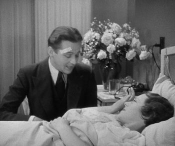 Movie still from “Bad Girl” (1931), directed by Frank Borzage – A man and a woman sitting in a hospital bed; Medium shot, High angle