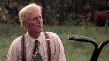 Movie still from “Blaze” (1989), directed by Ron Shelton – An older man wearing a tie and suspenders; Close Up shot, Over the shoulder angle