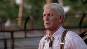 Movie still from “Blaze” (1989), directed by Ron Shelton – An older man wearing suspenders and a tie; Close Up shot, Low angle