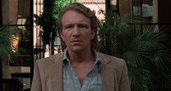 Movie still from “Body Double” (1984), directed by Brian De Palma – A person wearing a jacket; Close Up shot, Over the shoulder angle