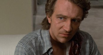 Movie still from “Body Double” (1984), directed by Brian De Palma – A person with long hair; Close Up shot, Over the shoulder angle