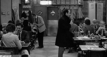 Movie still from “Broadway Danny Rose” (1984), directed by Woody Allen – A group of people sitting at tables in a restaurant; Wide shot, Over the shoulder angle