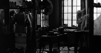 Movie still from “Broadway Danny Rose” (1984), directed by Woody Allen – A room filled with lots of tables and chairs; Wide shot, Over the shoulder angle