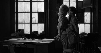 Movie still from “Broadway Danny Rose” (1984), directed by Woody Allen – A man and a woman tied up in a room; Wide shot, Over the shoulder angle