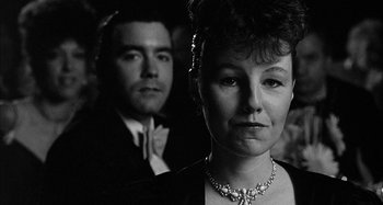 Movie still from “Broadway Danny Rose” (1984), directed by Woody Allen – A man and a woman in formal attire; Close Up shot, Low angle