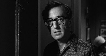 Movie still from “Broadway Danny Rose” (1984), directed by Woody Allen – A black and white photo of a man wearing glasses; Close Up shot, Low angle