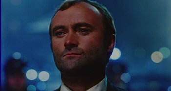A person wearing a suit and tie