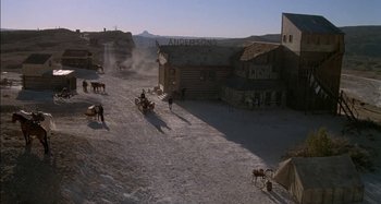 Movie still from “Butch and Sundance: The Early Days” (1979), directed by Richard Lester – An aerial view of an old western town; Extreme Wide shot, High angle