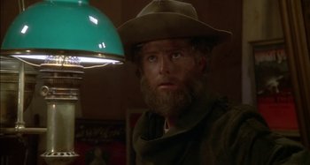Movie still from “Butch and Sundance: The Early Days” (1979), directed by Richard Lester – A man with a beard wearing a hat; Close Up shot, Low angle