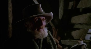 Movie still from “Butch and Sundance: The Early Days” (1979), directed by Richard Lester – An old man wearing a hat and a scarf; Close Up shot, Low angle